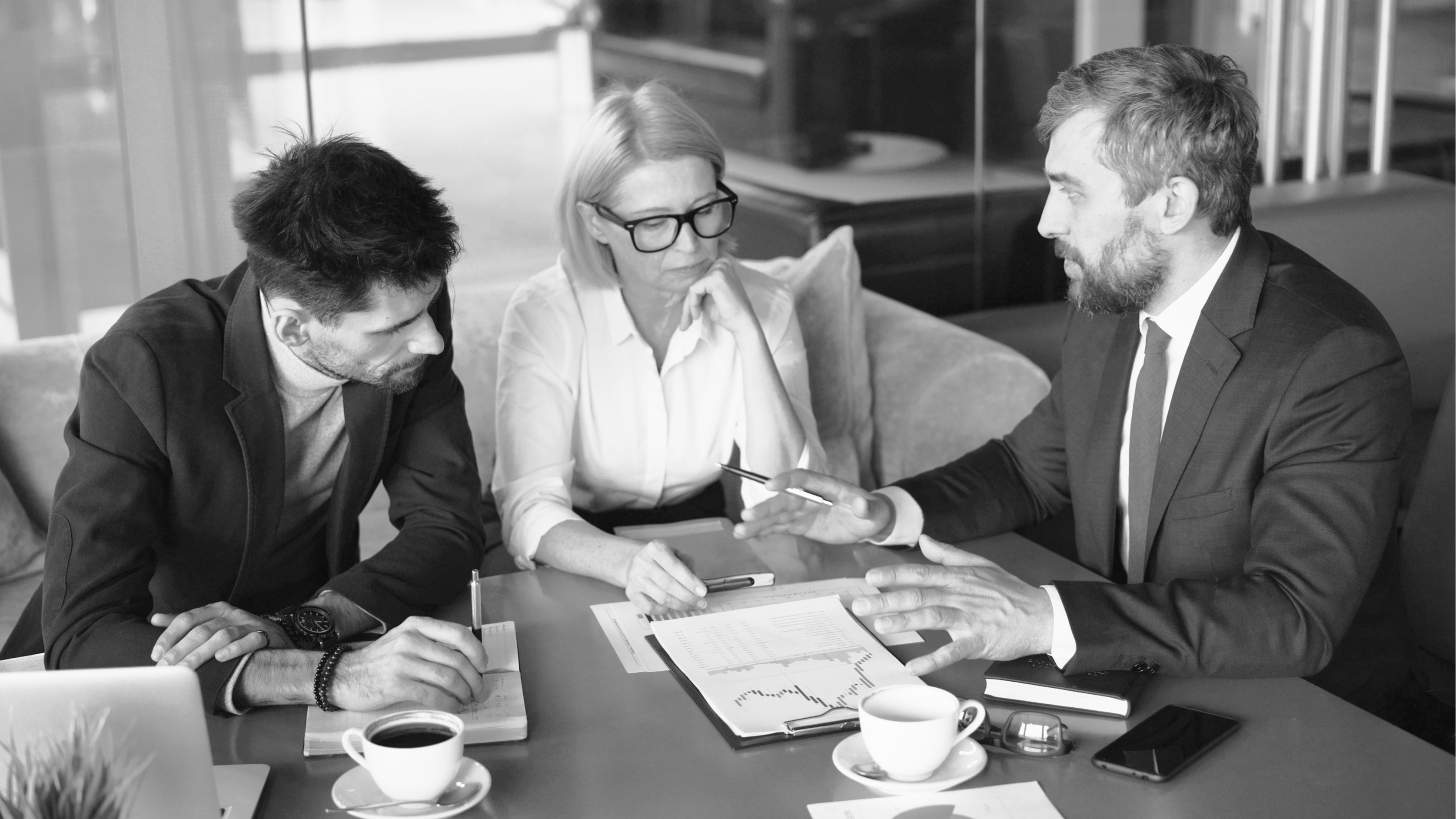 Team meeting in glass office